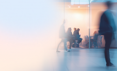 People in an office space, blurred
